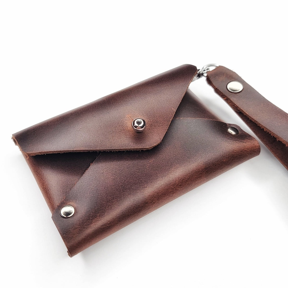 Handmade brown leather wristlet wallet with chrome Sam Browne button with cash compartment by Echo Six Designs