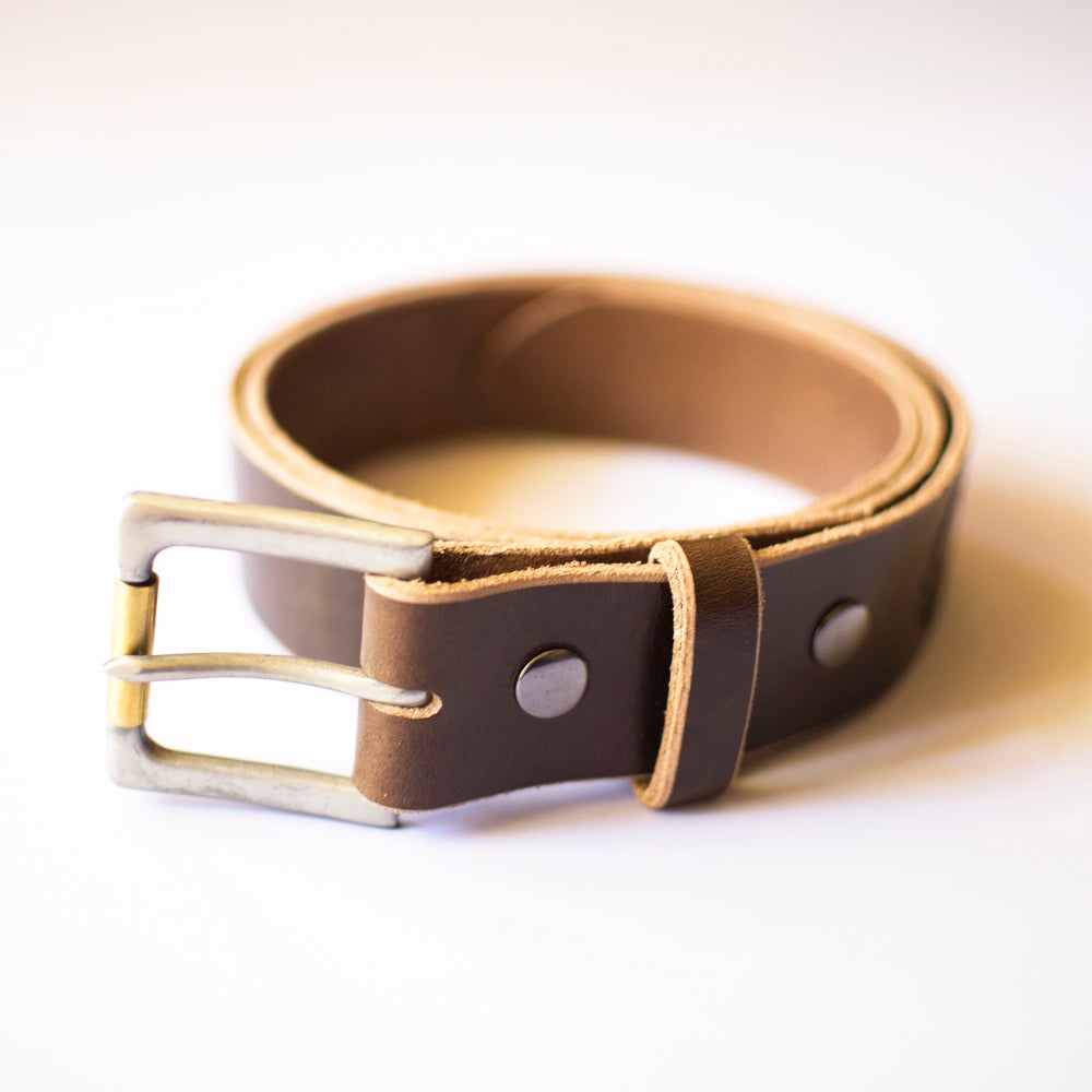 Handmade brown full grain leather belt with exquisite craftsmanship and natural texture