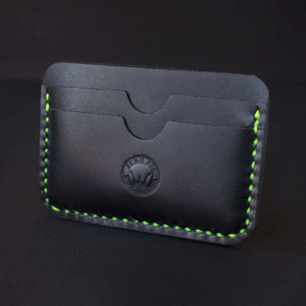 Handmade black full grain leather 5 pocket slim wallet, a stylish and compact accessory for organizing cards and cash