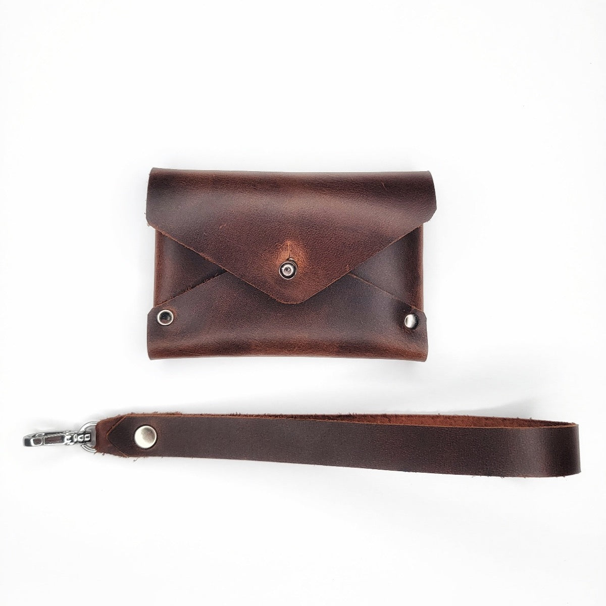 Handmade brown leather wristlet wallet with chrome Sam Browne button with cash compartment by Echo Six Designs