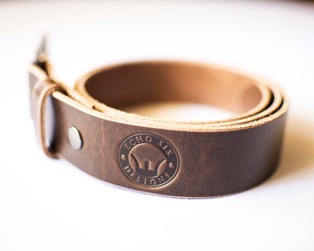 Handmade brown full grain leather belt with exquisite craftsmanship and natural texture